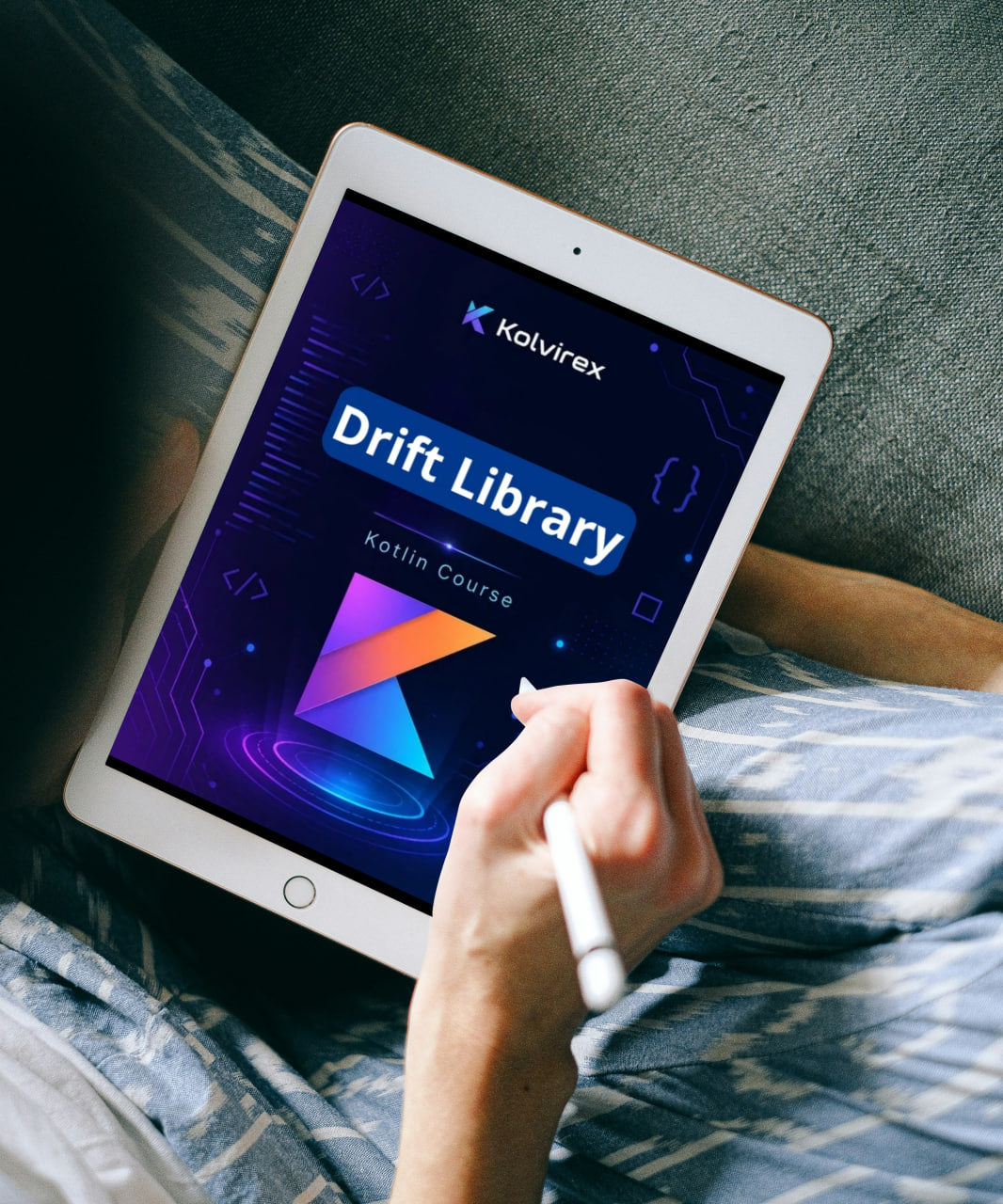 Person holding a tablet displaying Kolvirex Drift Library on a textured surface