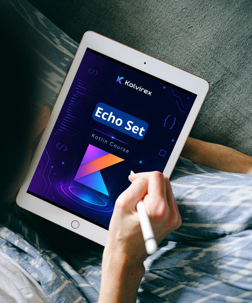 Person holding a tablet displaying the Kolvirex Echo Set course on a bed.